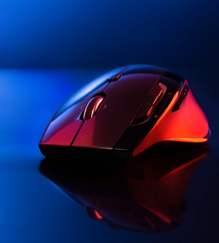 High technology computer gaming mouse in blue tone with reflaction